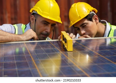 Asian University Student Learning Alternative Sustainable Energy And Set Up Solar Panel With Professor. Engineering Team Working On Checking And Maintenance Solar Cell On Rooftop Of Factory Building.