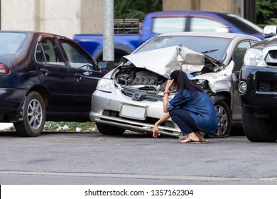 Asian Upset Driver Woman In Front Of Automobile Crash Car Collision Accident In City Road