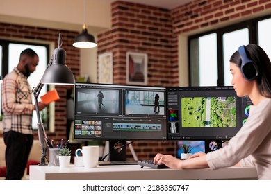 Asian Video Editor Working With Multimedia Footage, Editing Film Montage With Color Grading And Sound, Working On Freelance At Home. Using Post Production Software To Make Movie.