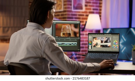 Asian videographer editing multimedia film footage on pc, using visual effects software on display. Developing video montage with color gradient, creating professional content. . - Shutterstock ID 2176483187