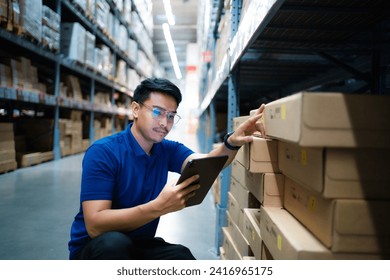 Asian warehouse worker uses tablet computer looking at merchandise. Logistics and export business Logistics distribution center. - Powered by Shutterstock