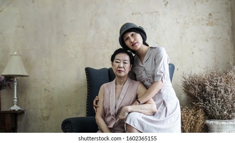 Asian Wealthy Family Daughter And Mother Portrait In Beautiful House