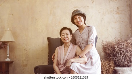 Asian Wealthy Family Daughter And Mother Portrait In Beautiful House