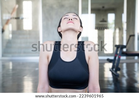 Asian woamn practice yoga flexibility in fitness gym meditation exercise