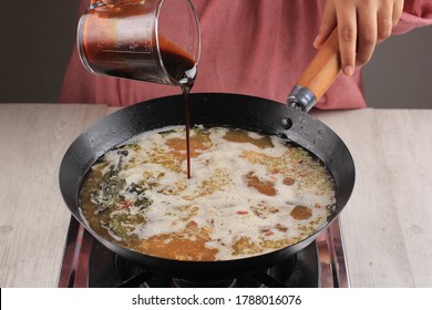 Asian Woman Add Sweet Soy Sauce To The Pan, Cooking Process Making Delicious Food