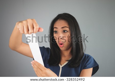 Asian woman amaze with the bill paper.