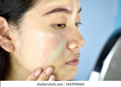 Asian Woman Applying Cosmetics Makeup And Using Color Correction Concealer, Face Skin Preparing Before Makeup Foundation, Learning Doing Self Makeup.