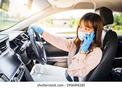 Asian woman beautiful attractive using mobile phone calling contact technology, driving car traveling wearing gloves protective face mask protection safety during coronavirus covid-19 outdoor pandemic