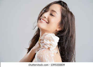 Asian Woman Being Happy With The Shower. Studio Concept