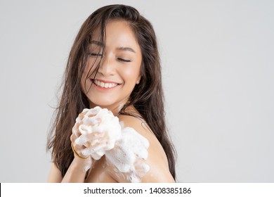 Asian woman being happy with the shower. Studio concept