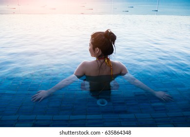 Asian Woman In Bikini Relaxing At The Pool Summer Comcept