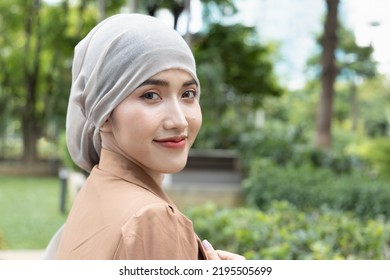 Asian Woman Cancer Patient Looking Back In Green Rehabilitation Center