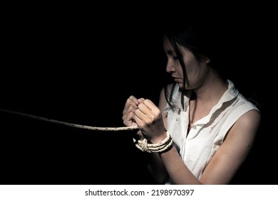 Asian Woman Was Capture In Dark Room As Slavery. Human Trafficking Is International Crime That Abuse Violence Victim Illegal. They Captive For Trade Sexual Labor Without Human Right Help, Copy Space