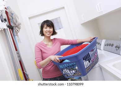 Asian Woman Carrying Laundry Basket