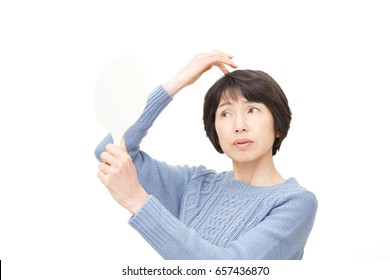 Asian Woman Checking A Hair