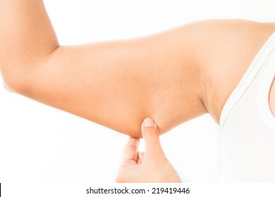 asian woman checking her upper arm