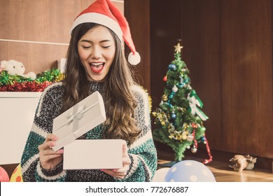 Asian Woman In Christmas Holiday Party With Gift