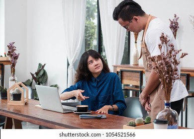 Asian Woman Customer Complaining To Waiter About Food In Cafe Restaurant,unhappy Emotion Service In Coffee Shop