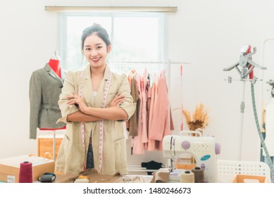 Asian Woman Designer As A Startup Business Owner In Her Tailor Shop