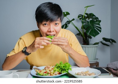 Asian Woman Dining Table With Thai Food, Papaya Salad And Grilled Chicken. Eat Alone At Home.