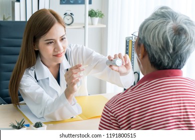 Asian Woman Doctor Check Tonsil Gland Of Patient