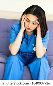 Asian Woman Doctor Stressed With Migraine Headache Overworked. Professional Doctor With Stethoscope At Hospital Feeling Unhappy,tired,disappointed,pain,trouble. Mixed Race Asian Chinese Model.