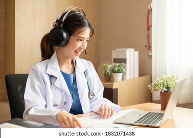 Asian Woman Doctor Talking With Patient Via Video Call Conference, Telehealth Or Telemedicine Concept