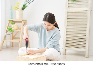 Asian Woman Doing Do-it-yourself Projects.