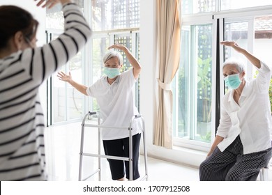 Asian Woman Is Doing Exercise Activities For The Elderly People,family Workout To Reduce Stress During The Pandemic Of Covid-19,fight The Coronavirus,healthy Senior, Fitness For Health Care,stay Home