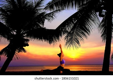 Asian Woman Doing Yoga Beach With Sun Rise Light Refletive Colorful Beauty Sky Abstract Background