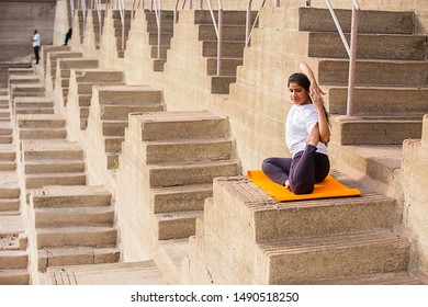 Asian Woman Doing Yoga Stretching Exercise Outdoor, Body Fitness And Health Concept