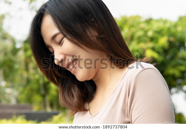 asian woman with\
double chin problem, concept of excessive fat on chin, fat face,\
jawline beauty correction\
