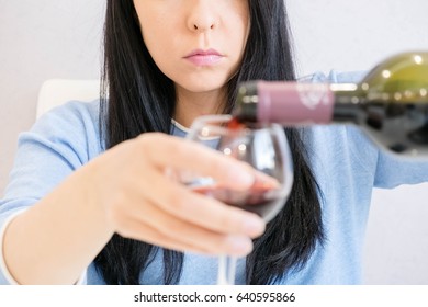 Asian Woman Drinking Alcohol. Female With Glass Red Wine. Addiction Concept, Shallow DOF. Alone Young Brunette Woman In Depression, Drinking Alcohol. Unrecognizable.