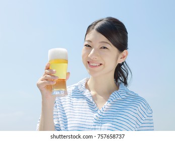 Asian Woman Drinking The Beer