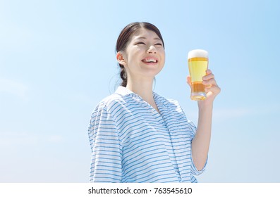 Asian Woman Drinking The Beer