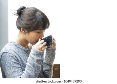 Asian Woman Drinking Coffee At Home. Relaxation, Coffee Break. 