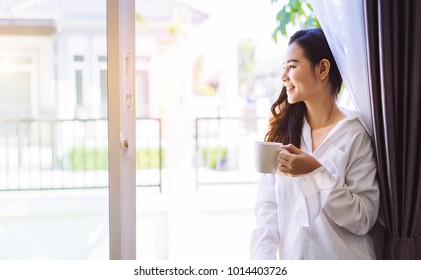 Asian Woman Drinking Coffee In The Morning Breakfast In Window Bedroom Fresh Start The Day Happiness Relax At Home Healthy Lifestyle Concept