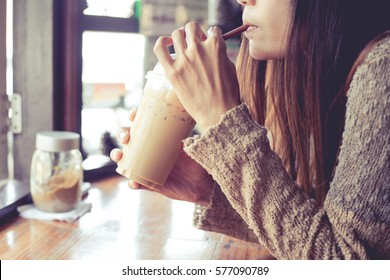 Asian Woman Drinking Ice Coffee