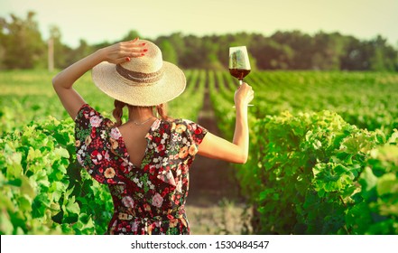 Asian Woman Drinking Red Wine At Vineyard During Her Vacation, Vintage Style