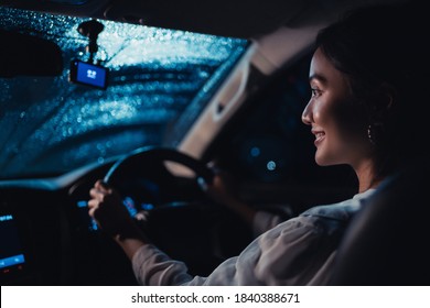  Asian Woman Is Driving Alone At Night. It's Raining. She Is Lonely.