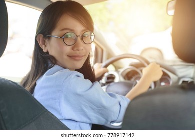 Asian Woman Driving Car With  Feeling Happy.