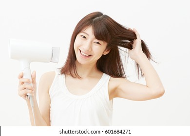 Asian Woman Drying Her Hair