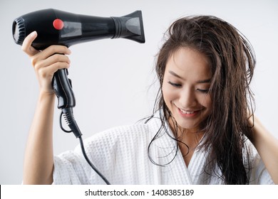Asian woman drying your hair after showering