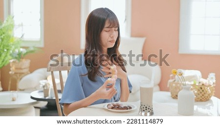 asian woman eat high sugar content food and has Gastroesophageal Reflux Disease feel uncomfortable