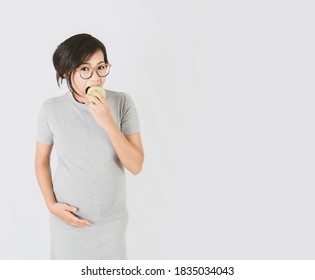 Asian Woman Eating Guava With Happy Mood.Focus On Face