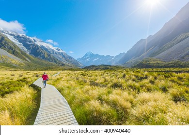 Asian Woman Enjoy Travel At Mt Cook National Park In South Island New Zealand, Summer Time, Concept Of Woman Solo Travel And Relaxation Moment
