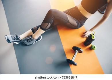 Asian Woman Exercising In The Gym, Young Woman Workout In Fitness For Her Healthy And Office Girl Lifestyle.