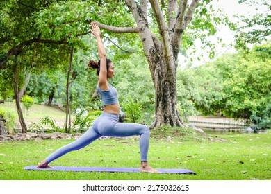 Asian Woman Exercising Outdoors In The Garden She Is Doing Stretching Yoga. Sports Concept Exercise For Good Health. Copy Space