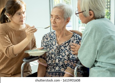 Asian Woman Feeding Tired Senior Patient,anorexia,eat Less Food,depressed Female Elderly Suffer From Depressive Disorder,symptoms Of Depression,loss Of Appetite,insomnia, Bored Of Food In Old People