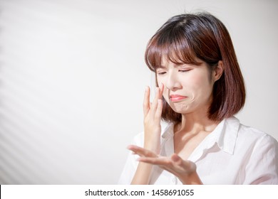 Asian Woman Feel Sad Because Her Skin Is Very Oily On Face